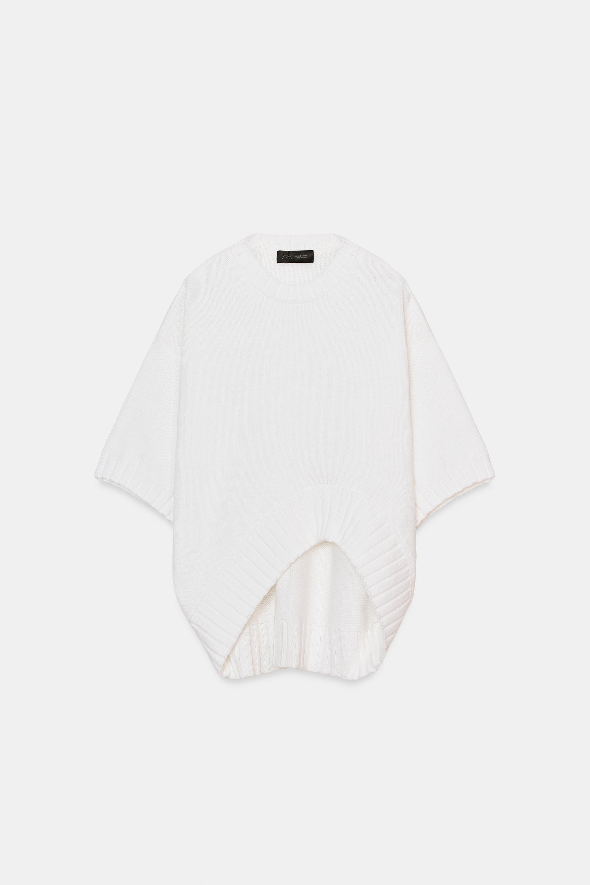 PULL EN MAILLE À MANCHES COURTES ET BAS ASYMÉTRIQUE
